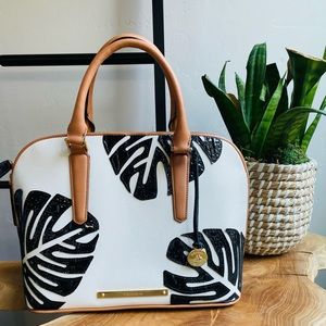 Brahmin handbag with shoulder strap.